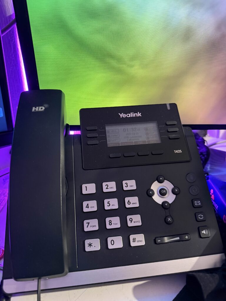 Yealink IP phone showing a time of 01:32 and six PBXes configured.